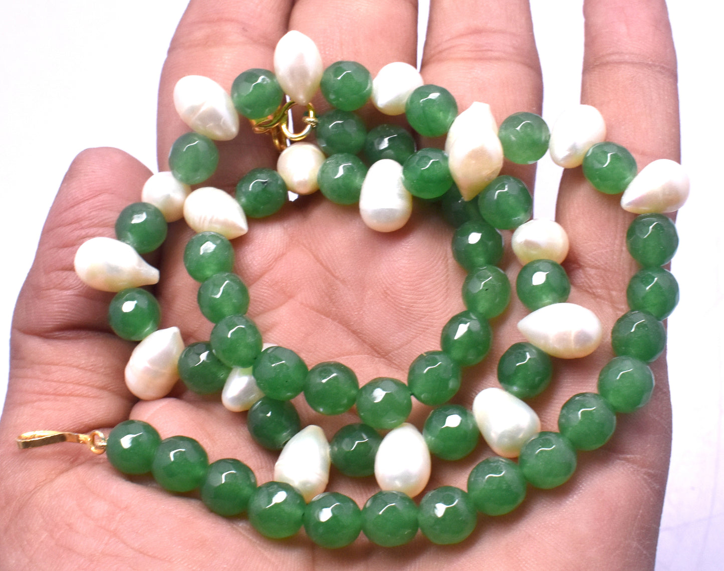 This elegant necklace features Green Aventurine and Pearl Mix beads (7.5mm to 8x13mm) with a secure lock closure.
#GreenAventurineNecklace #PearlMixJewelry #GemstoneJewelry #ElegantNecklace #HealingCrystals #FashionJewelry